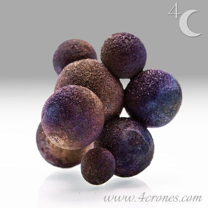 These stunning Chalcopyrite copper iron sulfide spheres (CuFeS₂) showcase a metallic golden luster with vibrant iridescent hues of purple, blue, and green. Formed through hydrothermal processes in Daye, Hubei Province, they crystallize in the tetragonal system and are valued for their aesthetic and energetic properties.