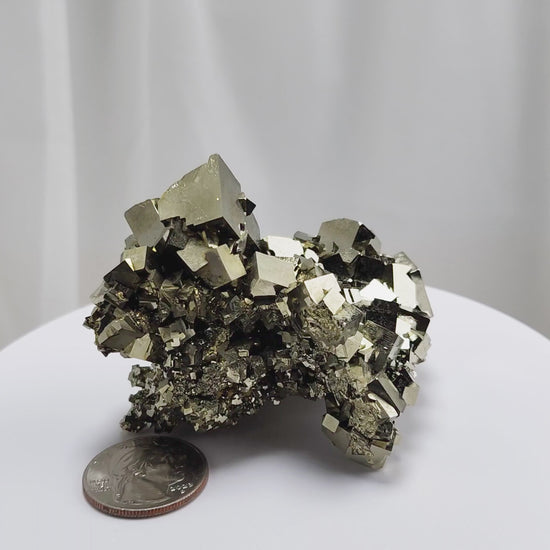 Shangbao Pyrite is a variety of pyrite, a sulfide mineral with the chemical formula FeS₂. Known for its metallic luster and brassy gold color, pyrite crystallizes in the isometric system, often forming cubic, octahedral, or pyritohedral crystals.