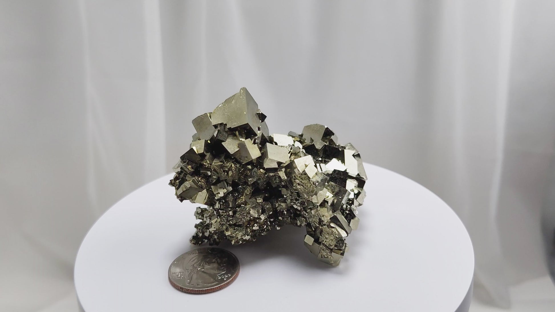 Shangbao Pyrite is a variety of pyrite, a sulfide mineral with the chemical formula FeS₂. Known for its metallic luster and brassy gold color, pyrite crystallizes in the isometric system, often forming cubic, octahedral, or pyritohedral crystals.