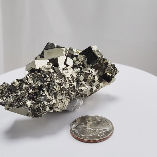 Shangbao Pyrite is a variety of pyrite, a sulfide mineral with the chemical formula FeS₂. Known for its metallic luster and brassy gold color, pyrite crystallizes in the isometric system, often forming cubic, octahedral, or pyritohedral crystals.