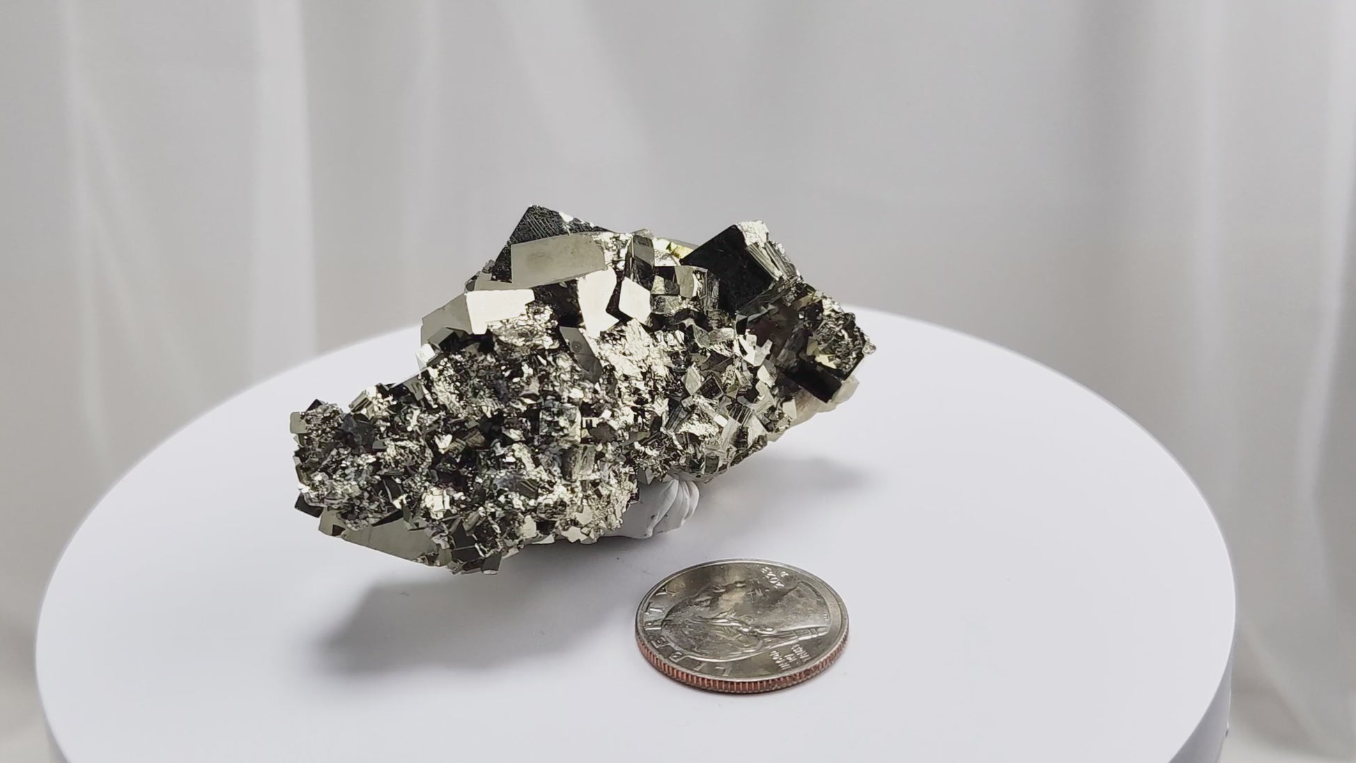 Shangbao Pyrite is a variety of pyrite, a sulfide mineral with the chemical formula FeS₂. Known for its metallic luster and brassy gold color, pyrite crystallizes in the isometric system, often forming cubic, octahedral, or pyritohedral crystals.