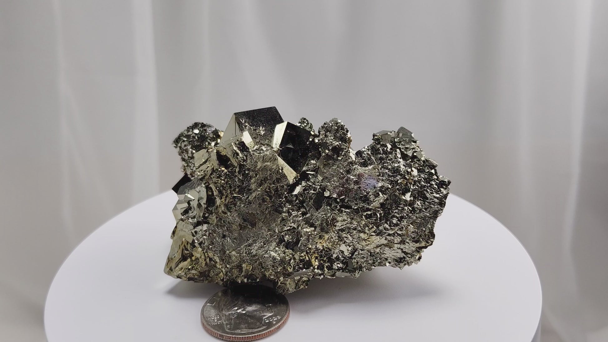 Shangbao Pyrite is a variety of pyrite, a sulfide mineral with the chemical formula FeS₂. Known for its metallic luster and brassy gold color, pyrite crystallizes in the isometric system, often forming cubic, octahedral, or pyritohedral crystals.