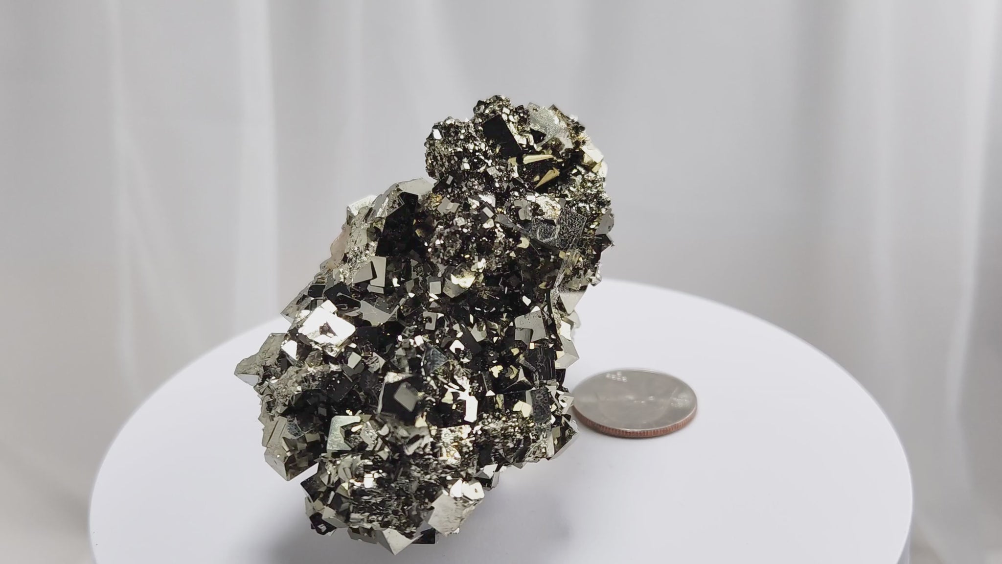 Shangbao Pyrite is a variety of pyrite, a sulfide mineral with the chemical formula FeS₂. Known for its metallic luster and brassy gold color, pyrite crystallizes in the isometric system, often forming cubic, octahedral, or pyritohedral crystals.