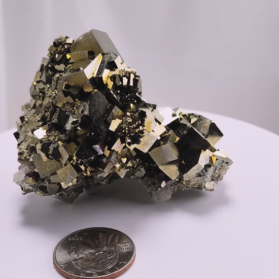 Shangbao Pyrite is a variety of pyrite, a sulfide mineral with the chemical formula FeS₂. Known for its metallic luster and brassy gold color, pyrite crystallizes in the isometric system, often forming cubic, octahedral, or pyritohedral crystals.