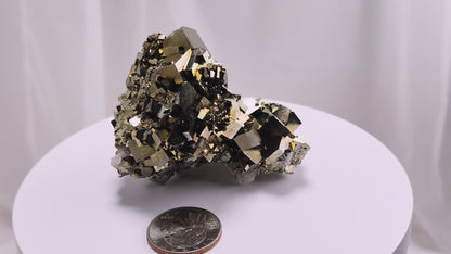 Shangbao Pyrite is a variety of pyrite, a sulfide mineral with the chemical formula FeS₂. Known for its metallic luster and brassy gold color, pyrite crystallizes in the isometric system, often forming cubic, octahedral, or pyritohedral crystals.