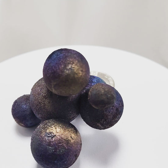 These stunning Chalcopyrite copper iron sulfide spheres (CuFeS₂) showcase a metallic golden luster with vibrant iridescent hues of purple, blue, and green. Formed through hydrothermal processes in Daye, Hubei Province, they crystallize in the tetragonal system and are valued for their aesthetic and energetic properties.